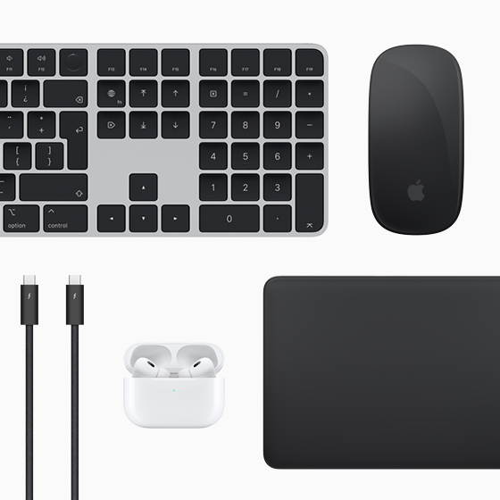Vista superior de los accesorios para la Mac: Magic Keyboard, Magic Mouse, Magic Trackpad, AirPods y cables Thunderbolt