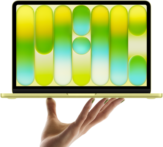 MacBook Neo color amarillo cítrico, sostenida en equilibrio en la punta de los dedos de una mano abierta, la pantalla muestra un patrón abstracto y colorido
