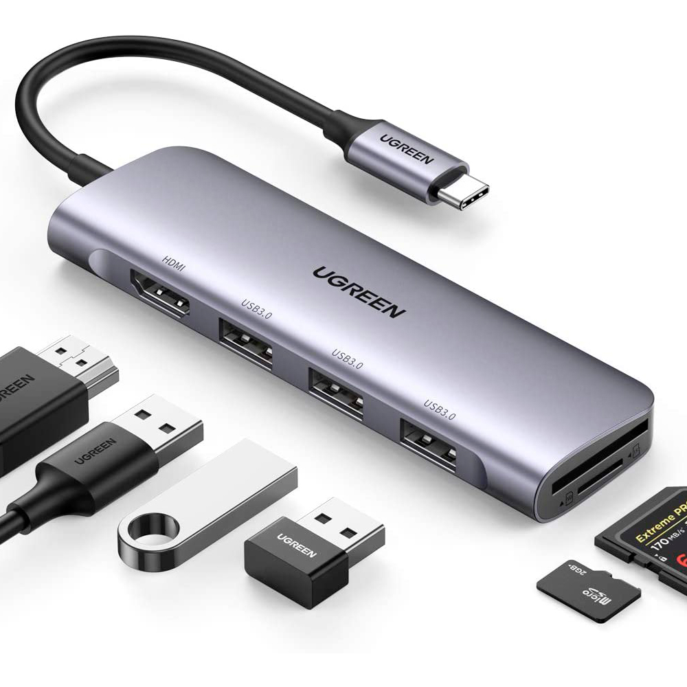 HUB USB C instantáneo 6 en 1 Expanda a más puertos para conectar más. El HUB de datos UGREEN 6-en-1 USB-C cuenta con un puerto de salida HDMI 4K, lectores de tarjetas SD y TF y 3 puertos USB 3.0. Puerto HDMI para fiesta visual 4K UHD Refleje o extienda su pantalla con el puerto HDMI del adaptador UGREEN USB C y transmita directamente video 4K UHD, Full HD 1080p o 3D a HDTV, monitor o proyector. Adaptador de tarjeta SD / TF compacto y eficaz Permite leer 2 tarjetas de memoria simultáneamente a una supervelocidad de 104 MB / S y es ampliamente compatible con las siguientes tarjetas. Transferencia de datos de supervelocidad de 5 Gbps Este concentrador USB tipo C agrega 3 puertos USB 3.0 adicionales para conectar múltiples dispositivos periféricos USB como unidad flash, disco duro, teclado, mouse, impresora, reproductor MP3 y más. El HUB de puertos múltiples podría mantenerlo alejado de los problemas de enchufar y desenchufar repetidamente. Admite transferencias de datos súper rápidas de hasta 5 Gbps, lo que le permite transferir películas o archivos HD en solo segundos. Leer tarjetas SD / TF simultáneamente Las ranuras SD y TF incorporadas acceden fácilmente a archivos desde la tarjeta SD universal y la tarjeta Micro SD; Admite 2 tarjetas que se leen simultáneamente. El lector de tarjetas UGREEN USB C SD transfiere datos con la mayor velocidad hasta 100MB / S, compartiendo todos tus intereses en tu red social libremente. Amplia compatibilidad Mac / iPad USB tipo C Apple MacBook Pro (2019/2018/2017/2016), MacBook (2016/2017/2018), iMac 2019/2017, iMac Pro, MacBook Air 2019/2018, Mac Mini, Nueva MacBook con Thunderbolt 3. Contenido del paquete 1 x Adaptador USB C 6 en 1 con HDMI 4K 1 x manual de usuario 